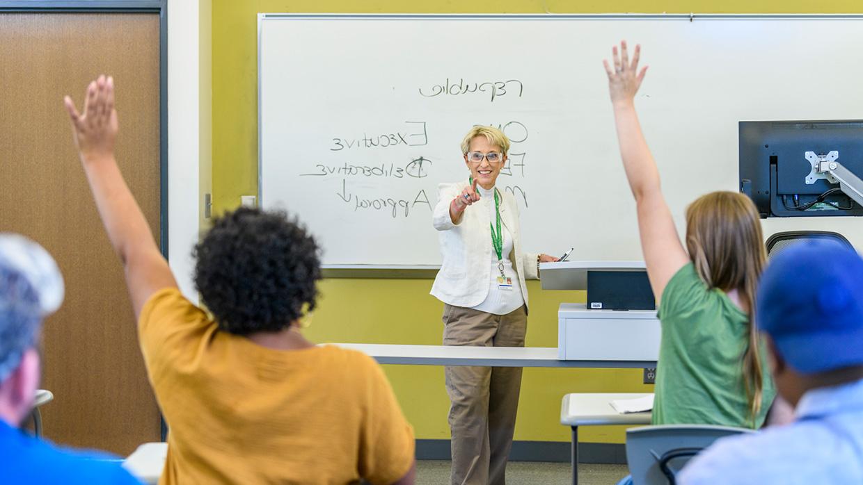 Teacher working with students